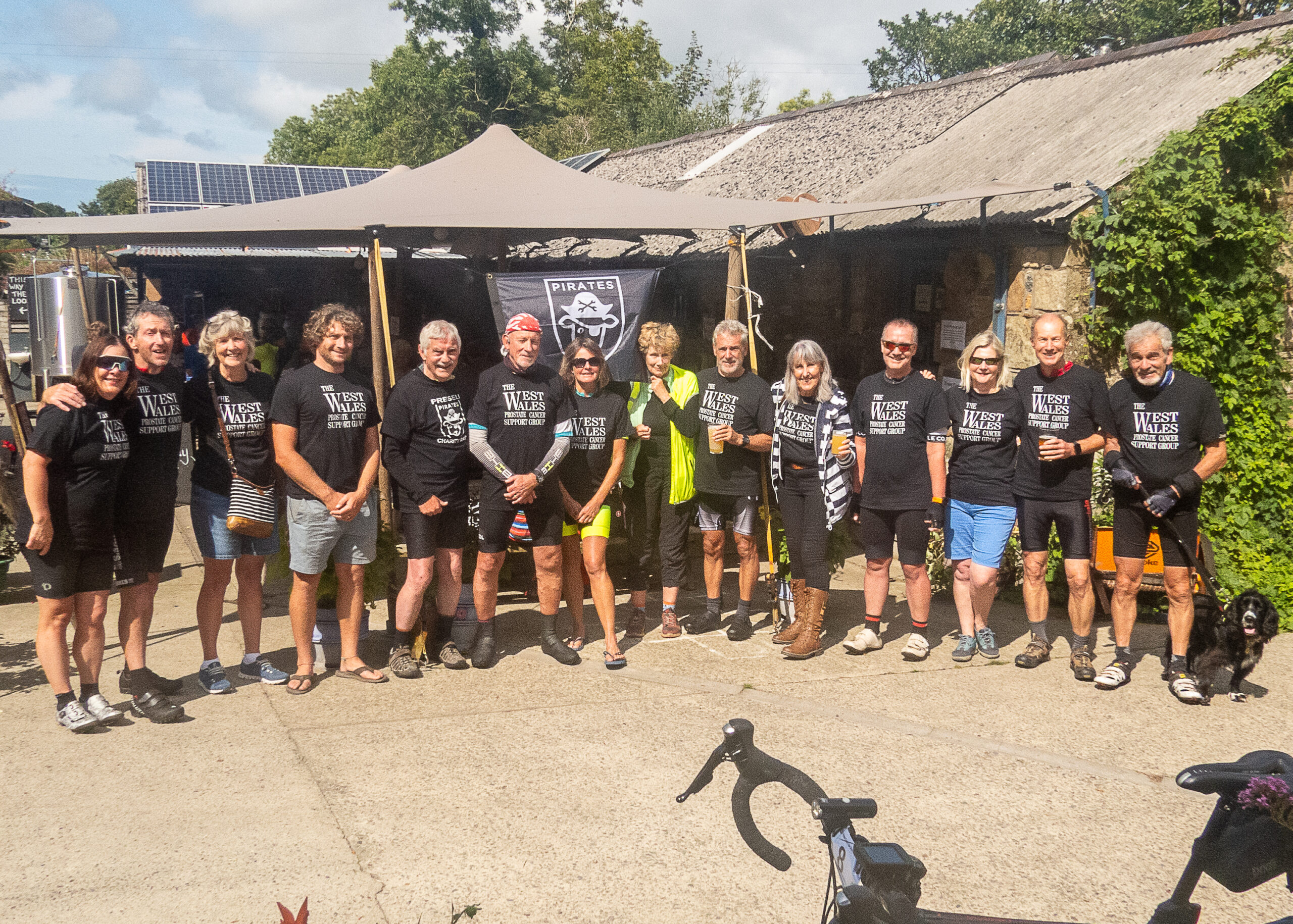 Some of the riders ready to go wearing the T shirts for the event. Peter and his wife Julie are 2nd and 3rd from the left.